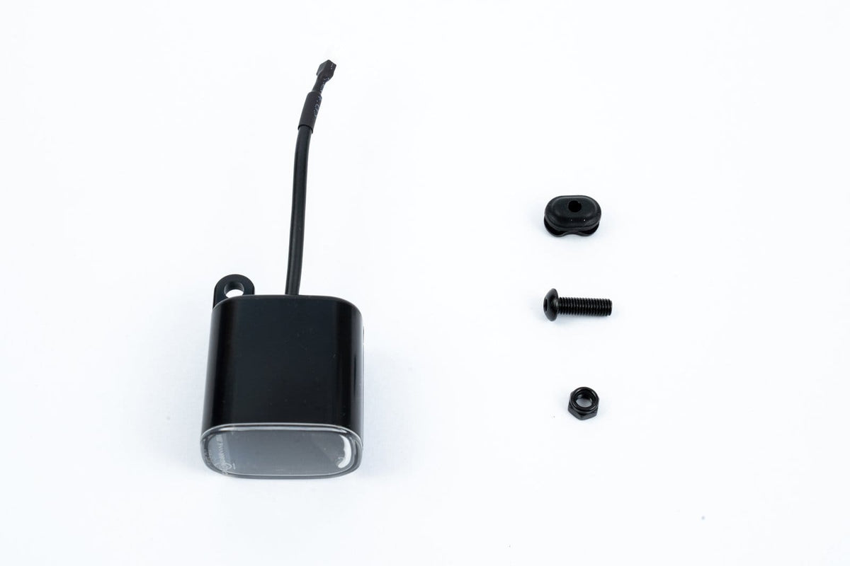 Pure Electric front light assembly with grommet